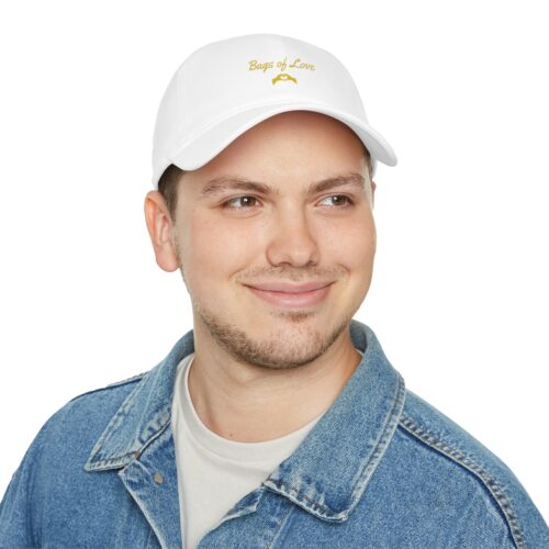 A man wearing a BOL white cap.