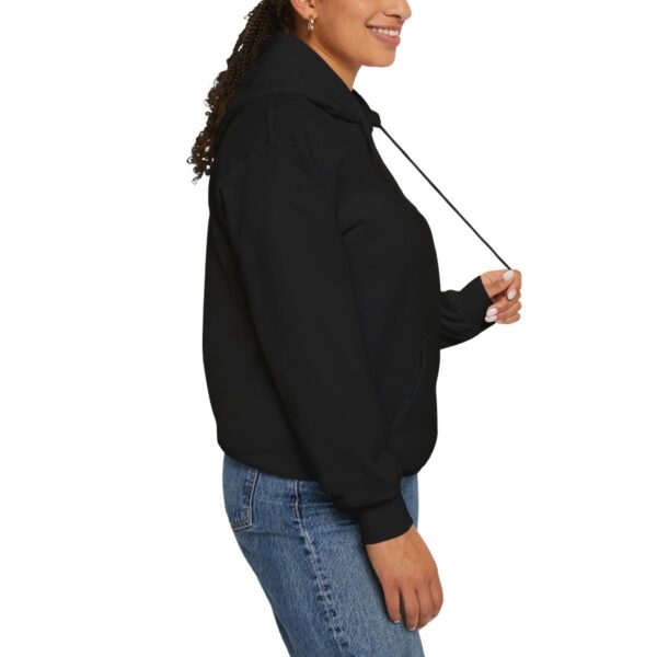 Side view of woman in BOL black sweatshirt.