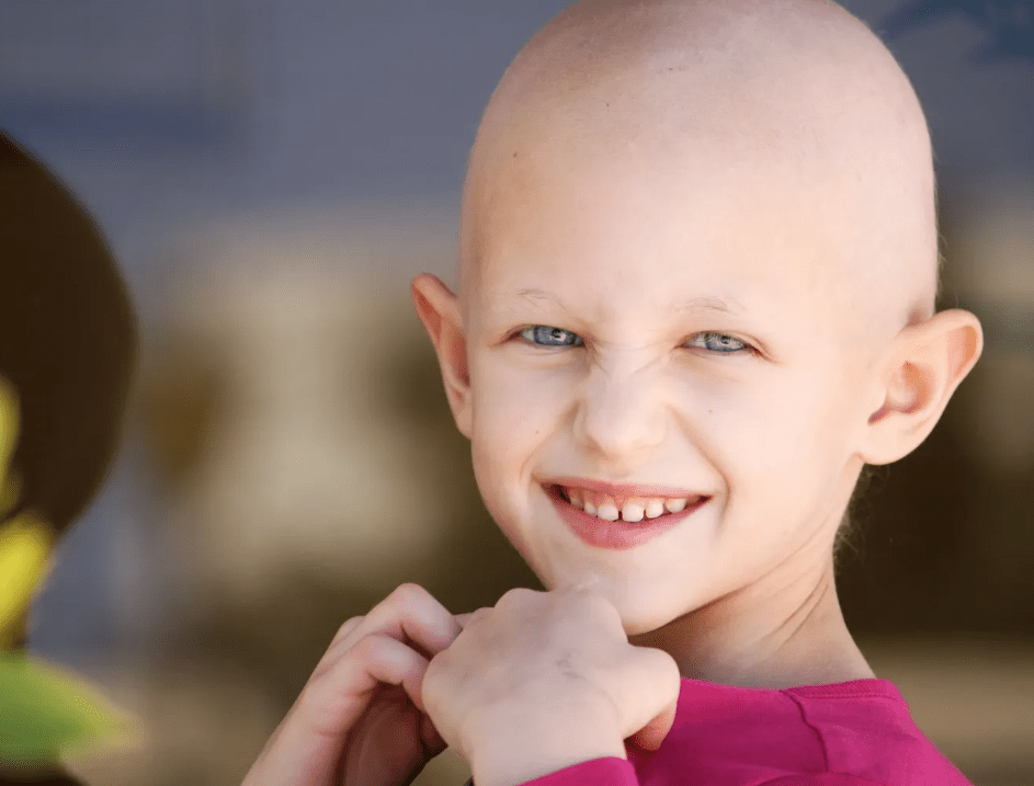 Young cancer patient smiling.